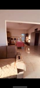 a living room with a couch and a table at Casa de veraneio jacuma in Conde