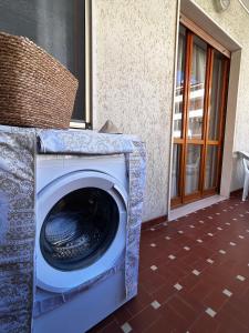 a washer and dryer sitting in front of a building at ELIOS Grand Apartment in Tropea