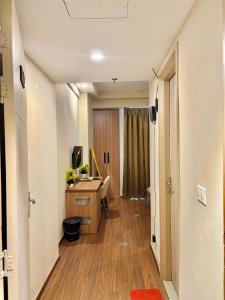 an office with a desk and a computer in a room at Luxury stays in Greater Noida
