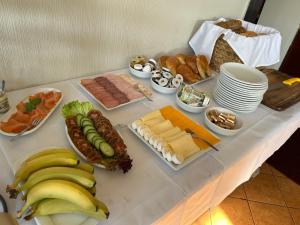 a table topped with lots of different types of food at Seehaus Miersdorf in Zeuthen