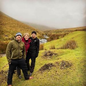 three people posing for a picture on a hill at Galtee Glamping in wooden yurt in Mitchelstown +3 photos