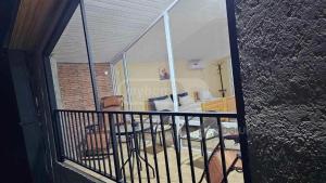 a view of a balcony with a living room at ksenia apartment in Borjomi
