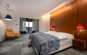 En eller flere senge i et værelse på Hotel IN