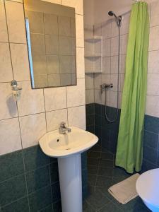 a bathroom with a sink and a shower at Villa Climate Guest House in Varna City +49 photos