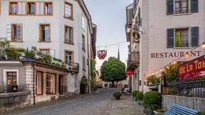 an empty street in a city with buildings at 120sqm Duplex Apartment with AirC Free Parking Family & Business in Biel