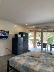 a bedroom with a large bed and a sliding glass door at Peaceful Turtle Camp in San Francisco