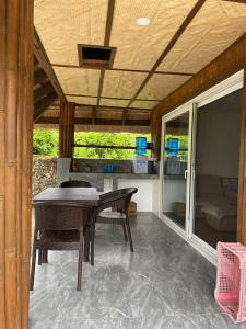 a patio with a table and chairs in a house at Peaceful Turtle Camp in San Francisco