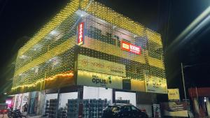 a large building with a lot of lights on it at Noble Darshan in Guruvāyūr