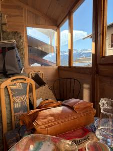 a table with a bag on top of a table at La Marguerite in Aigueblanche