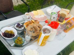 a white table with a tray of food on it at Hostel Struga in Struga