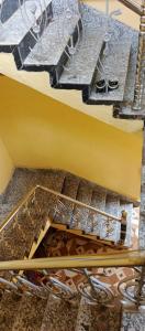 an overhead view of a stairs with shoes in it at Mohana Homestay in Tāki