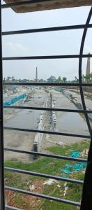 a view of a street from a window at Mohana Homestay in Tāki