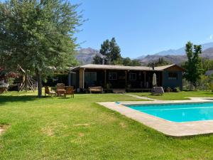a house with a swimming pool in the yard at Elqui LU ASPAR in Vicuña