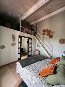 a bedroom with a bed and a staircase at La Bastide de Grosille in Savasse +149 photos