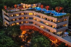 an aerial view of a hotel with a swimming pool at Pacific Club Resort in Karon Beach