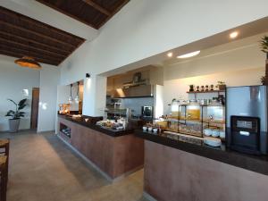 a kitchen with a counter with food on display at Alexena Apartments in Agia Galini