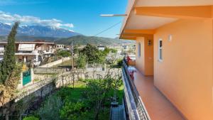 a balcony with a view of a city and mountains at Apartment Darlin Berat in Berat