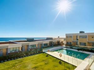 an aerial view of a building with a swimming pool at Eden50 in Mijas Costa