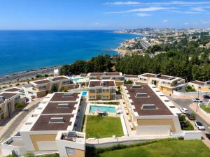 an aerial view of buildings and the ocean at Eden50 in Mijas Costa