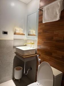 a bathroom with a sink and a toilet at Choox Villa Hotel in Koronadal +14 photos