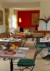 a living room with a table with food on it at Chateau le Quesnoy in Chevrières