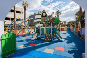 a playground at a resort with a roller coaster at Arina Beach Resort in Kokkini Khanion +161 photos
