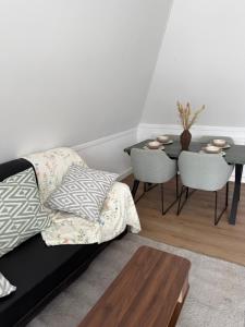 a living room with a couch and a table at IL Mulino House D, keukenhof in Hillegom +50 photos