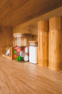 a wooden shelf with medicines and books on it at Tímár 18 Apartman in Pécs