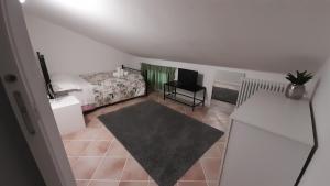 a small bedroom with a bed and a desk at Sotto i Lucernai in Cagli