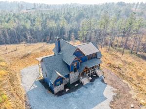 an aerial view of a house in a field at Blue Salamander Lodge in Talking Rock