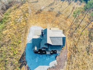 an overhead view of a house with a pond at Blue Salamander Lodge in Talking Rock