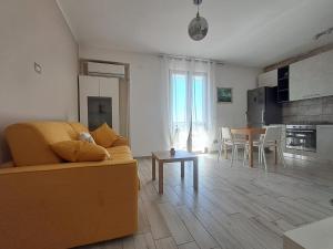 a living room with a couch and a table at Il Nido di Chiara 2 in Formia