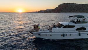 a group of people on a boat in the water at vip motoryat in Alanya