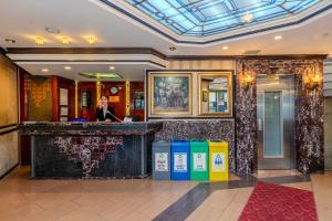 a man standing at a bar in a hotel lobby at Hotel Seren 2 in Istanbul