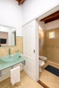 a bathroom with a sink and a toilet at Mirando al Mar I in Mar Azul +36 photos