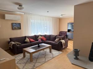 a living room with a couch and a coffee table at Tiigi Villa in Haapsalu