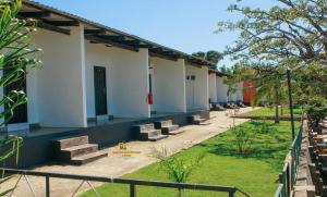 a row of buildings with stairs in a yard at Samfya waterfront lodge 