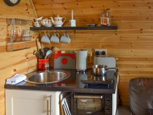a kitchen with a sink and a stove at Park View - Ukc4925 in Roydon