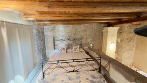 a bedroom with two beds and a wooden ceiling at Casale Ciricó tra Catania e Siracusa in Carlentini +48 photos