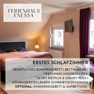 a poster of a bedroom with a bed and a tv at Ferienhaus Enessa in Lauchhammer