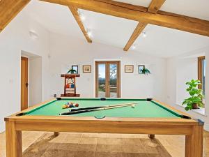 a living room with a pool table at Knoll View Ranch in Shepton Mallet