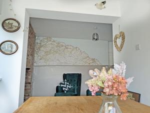 a room with a table and a map on the wall at Longshore in Runswick