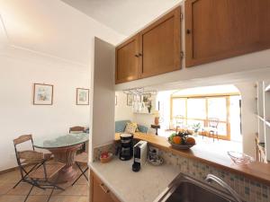 a kitchen with a sink and a counter top at Domus Floris in Positano