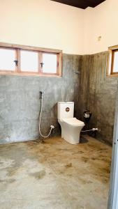 a bathroom with a toilet in a room at FA Resort in Panama +17 photos