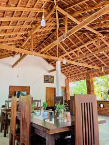 a dining room with a wooden table and chairs at FA Resort in Panama