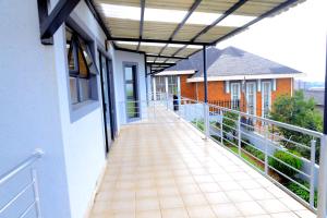a balcony of a house with awning over a walkway at Grand View B&B in Johannesburg