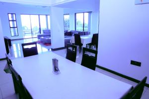 a room with a table and chairs and a living room at Grand View B&B in Johannesburg +39 photos
