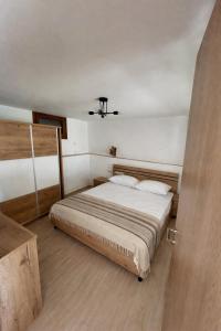 a bedroom with a large bed in a room at Balis House in Theológos