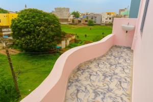 a balcony with a blue and white patterned floor at Greenwood stay in Bhilai