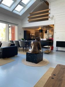 a living room with a statue of a woman at Mörrum, Haus 2 & 3 in Mörrum